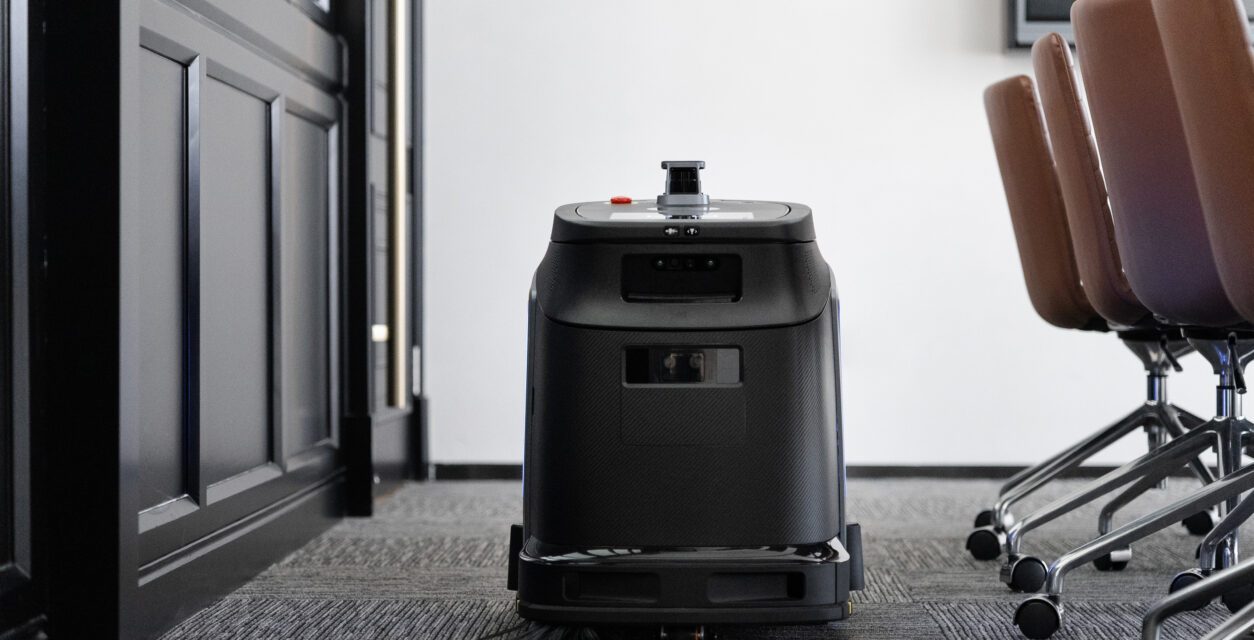 Autonomous floor-cleaning robot in an office